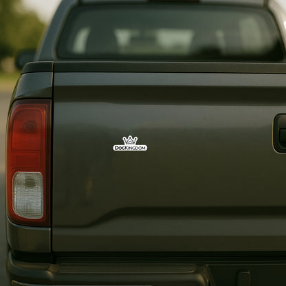 DogKingdom logo sticker displayed on the back of a black pickup truck tailgate